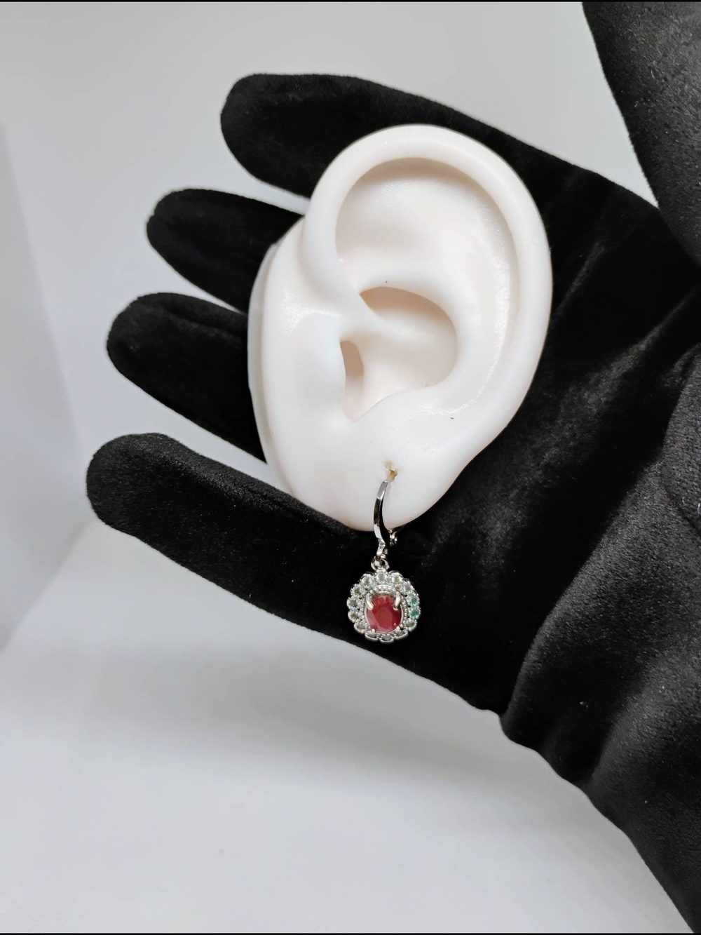 Ruby and Cuban Zirconia earrings oval gemstone surrounded by smaller clear stone